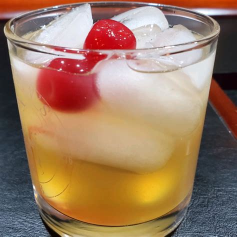 Add bourbon, lemon juice, and simple syrup; seal lid on shaker and shake until chilled and frost forms on shaker, about 15 seconds. Strain into a rocks glass filled with large ice cubes. Gently ...